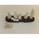 An early 20th Century carved ivory figure group comprising five various Japanese ladies in various