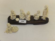 An early 20th Century carved ivory figure group comprising five various Japanese ladies in various