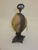 A mother of pearl mounted etui, the finial depicting Paris scenes, opening to reveal two bottles