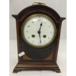 A mahogany cased mantel clock with Arabi