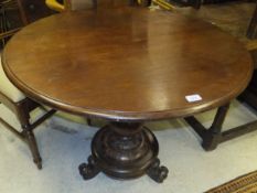 A Victorian mahogany breakfast table, the circular top on a turned pedestal to platform tripod