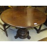 A Victorian mahogany breakfast table, the circular top on a turned pedestal to platform tripod