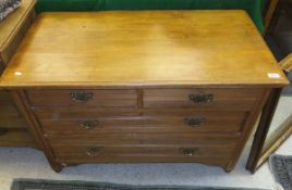 An Edwardian beech chest of two short ab
