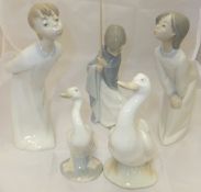 Two Lladro figures of children in nightg