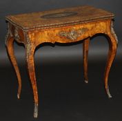 A 19th Century French walnut games table, the shaped rectangular top with floral marquetry inlay and