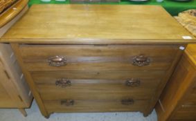 An Edwardian mahogany chest of three lon