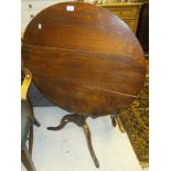 A 19th century oak tea table, the circul