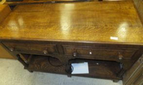 An oak two tier table with dummy drawers