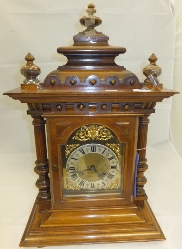 A circa 1900 walnut bracket clock, the b