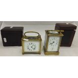 Two brass carriage clocks in leather cas