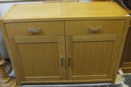 A modern oak sideboard with two drawers