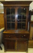 A 19th Century mahogany secretaire bookcase, the arched glazed doors enclosing shelves over