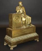 A 19th Century French gilt brass cased figural mantel clock decorated with seated figure of Cicero