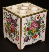 A 19th Century Paris porcelain cachepot of square form, painted with flowers and with porcelain