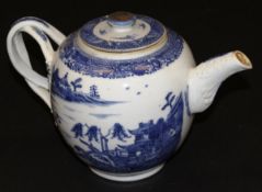 A Chinese porcelain "Willow" pattern blue and white export ware ovoid teapot with openwork handle