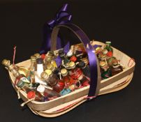 A basket containing 40 various miniature