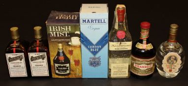 One bottle Martell Cognac Cordon Bleu, boxed, one bottle Irish Mist, boxed, one bottle Le Bon Père