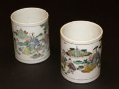 A pair of 19th Century Chinese Kangxi palette brush pots of cylindrical form, each with two panels