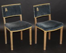 A pair of Elizabeth II 1953 Coronation chairs with upholstered back and seat on an oak frame