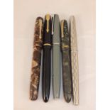 A collection of five vintage fountain pens to include a Burnham "The Nova" pen, Junior Parker