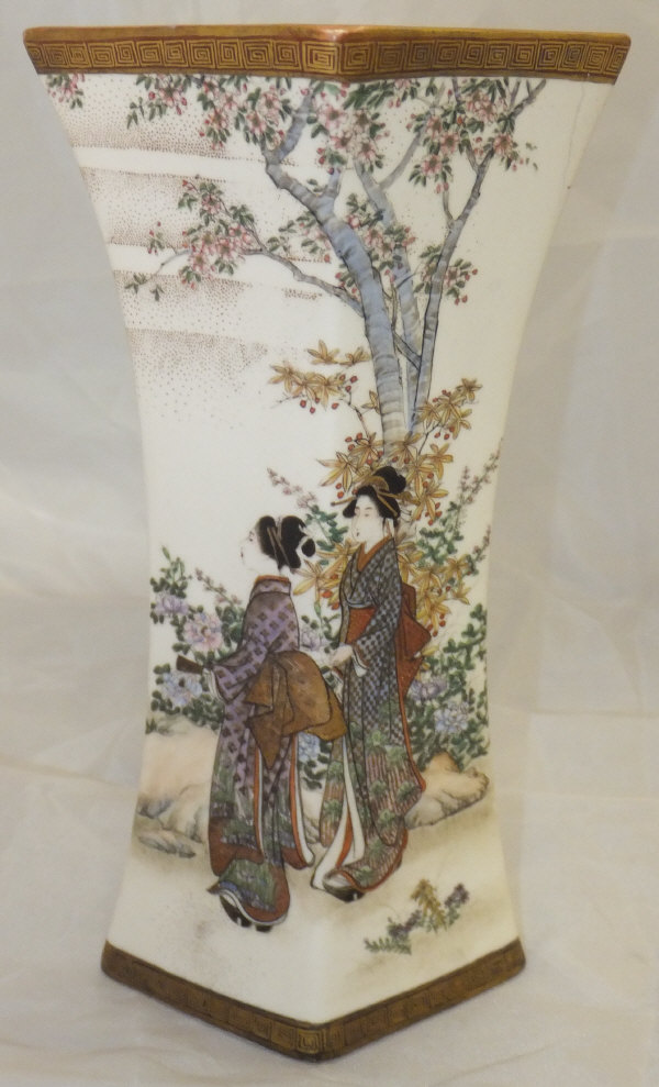 A satsuma vase of waisted lozenge form decorated with ladies in a garden setting, bearing