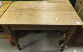 A small Victorian pine kitchen table, the plain top on turned and ringed legs CONDITION REPORTS