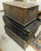 Two wooden trunks and a metal trunk