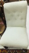 A Victorian upholstered buttoned back nu