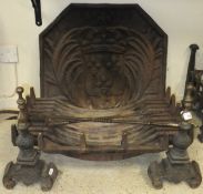 A cast iron fire grate, raised on two fi