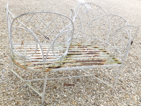 A white painted metal garden love seat CONDITION REPORTS Some peeling and losses to paint, and