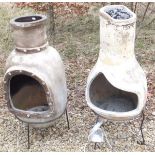 Two modern terracotta chimineas on iron