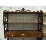 A mahogany and inlaid three tier wall shelf unit with two drawers in the Sheraton revival taste