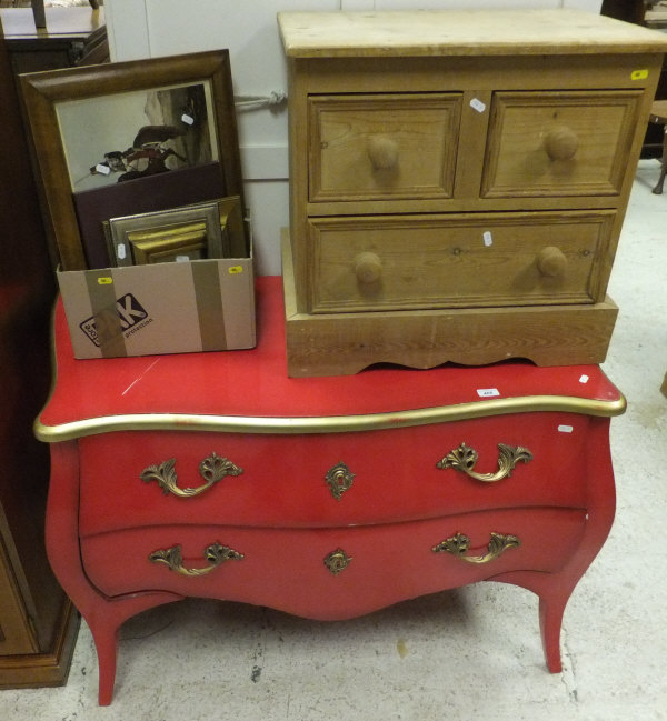 A modern red lacquered and gilt decorated bombé commode of two drawers in the Louis XV taste, a