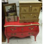 A modern red lacquered and gilt decorated bombé commode of two drawers in the Louis XV taste, a