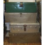 Four large metal trunks