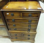 A small yew wood chest on chest
