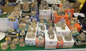 A large collection of Lilliput Lane cott