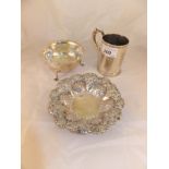 A silver Christening mug with scroll and