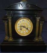 A mantel clock in polished slate, with A
