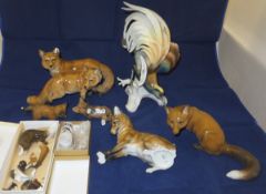 A collection of Rosenthal porcelain fox figures to include a figure group as a pair, two fox cubs