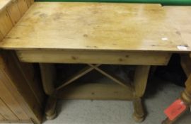 A waxed pine centre table on trestle sup