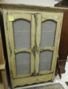 A painted French armoire with chicken wi