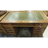 A yew wood nine drawer pedestal desk wit