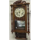 An A. Daniels of Tetbury mahogany framed pendulum wall clock with Roman numerals to the dial