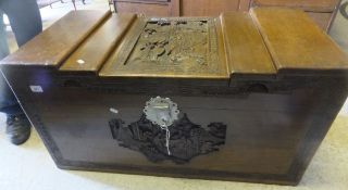 A Far Eastern carved camphor wood trunk with figural decoration CONDITION REPORTS Approx 101 x
