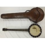 A vintage 4½ string banjo by W. Temlett London, No'd 3458, housed in an embossed leather carrying