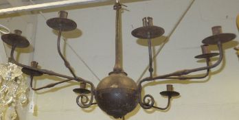 A wrought iron chandelier in the Flemish