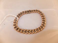 A 9 carat gold link bracelet CONDITION REPORTS Wear, scuffs, dirt.  A loop for a small retaining