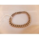 A 9 carat gold link bracelet CONDITION REPORTS Wear, scuffs, dirt.  A loop for a small retaining