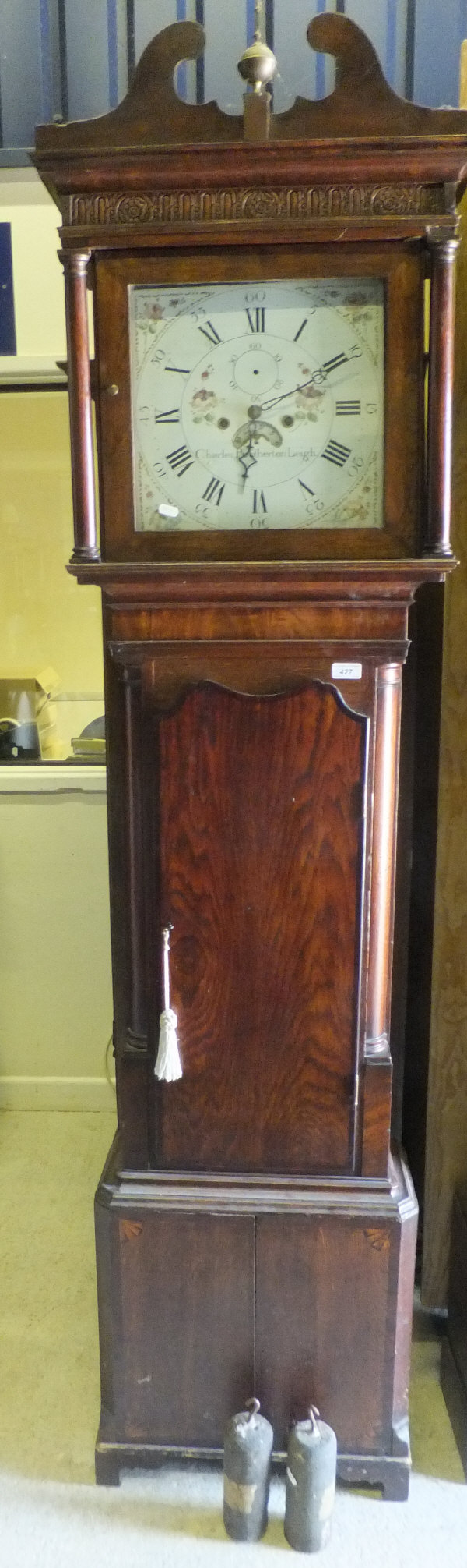 An early 19th Century oak long cased clock, the eight day movement with enamelled dial, Roman and